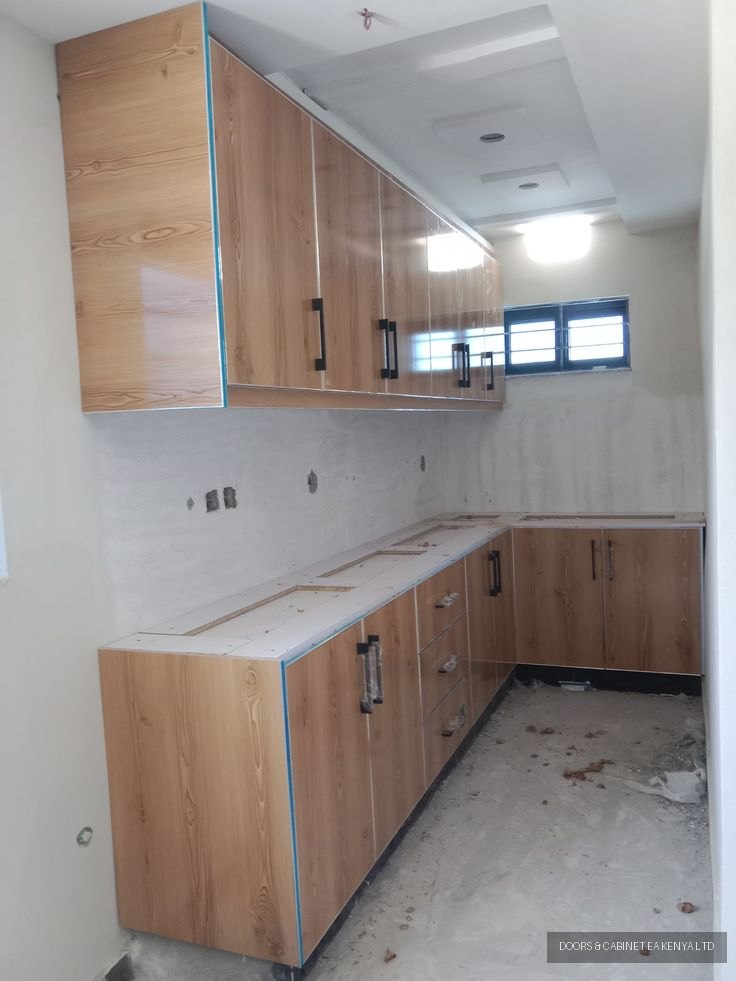 Pine Gloss L-Shaped Kitchen — Kitchen Cabinets by Doors and Cabinet EA, Mombasa