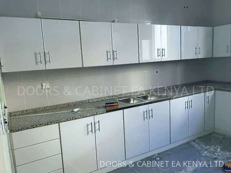 White Gloss & Granite Kitchen — Kitchen Cabinets by Doors and Cabinet EA, Mombasa